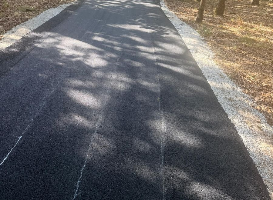 New asphalt through wooded property